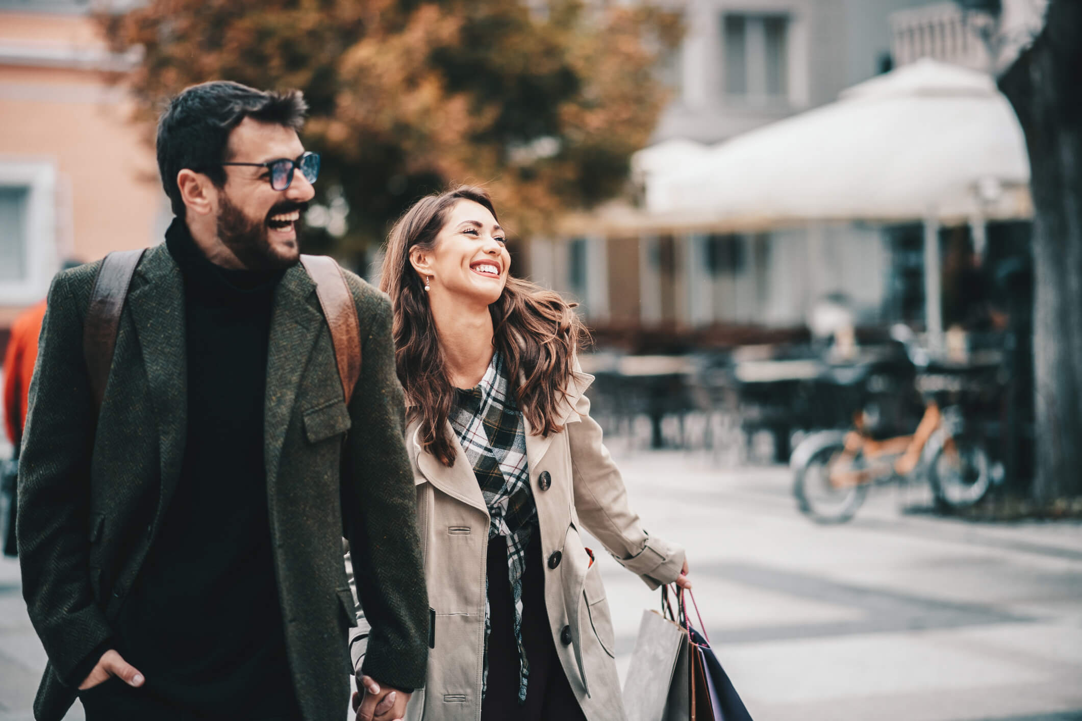 Couple walking down the street smiling