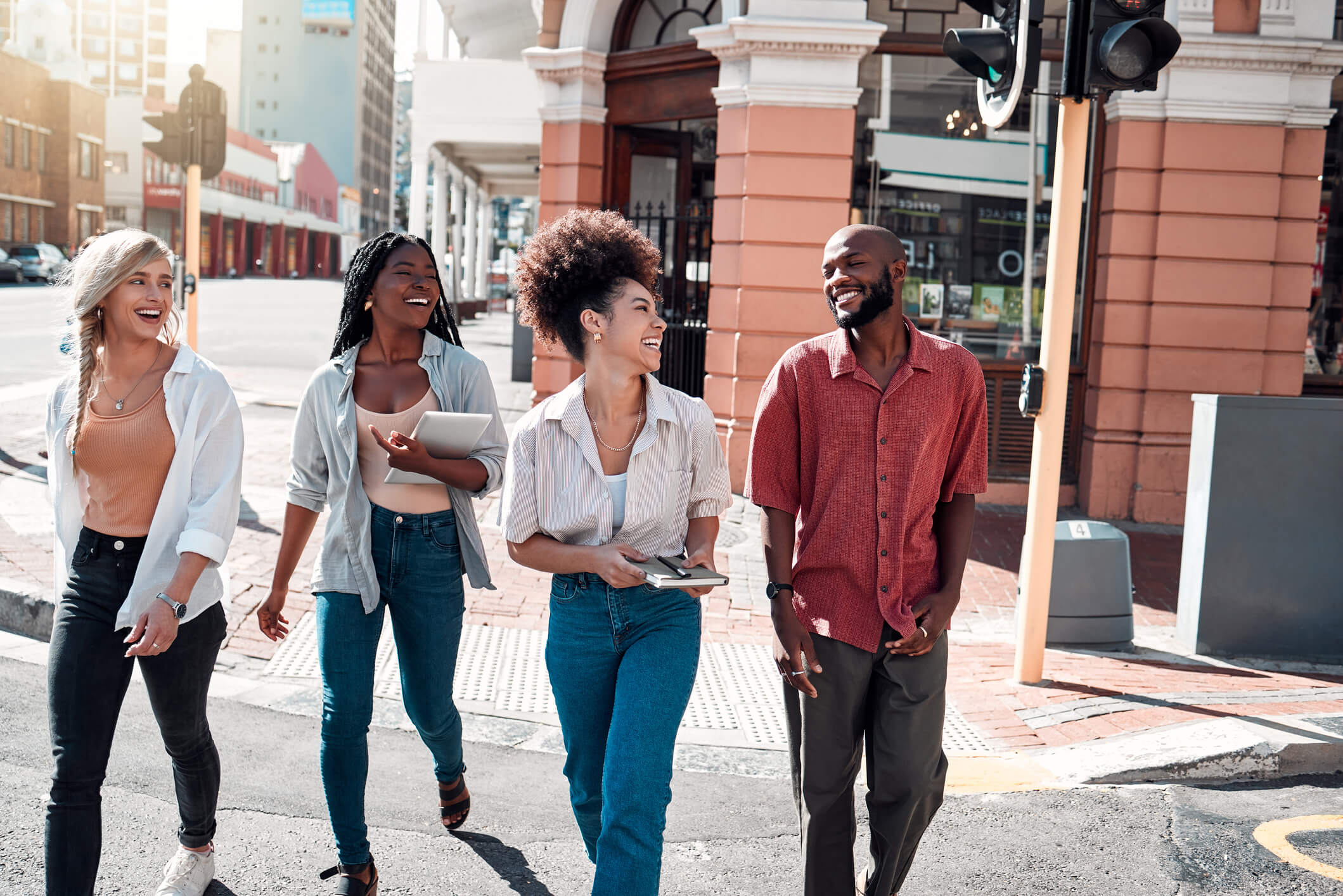 Group of friends walking down a city street