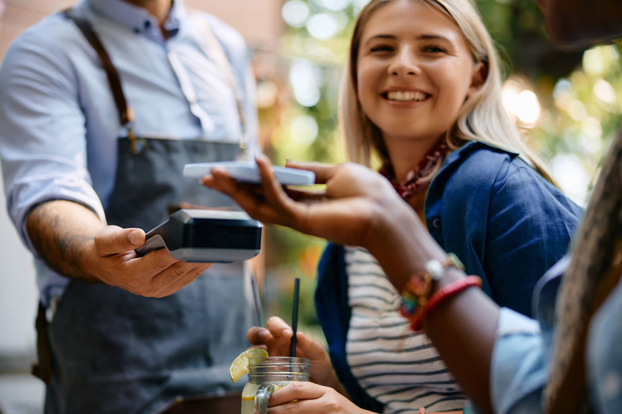 Person making a payment with mobile device at a restaurant